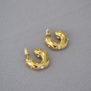 Chunky gold C-shaped hoop earrings with sparkling rhinestones and 925 silver needles