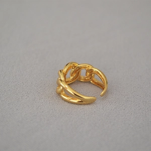 Niche twisted chain link ring in gold-plated brass with adjustable open band design