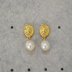 Detail of vintage Queen Elizabeth coin relief earrings with baroque freshwater pearls