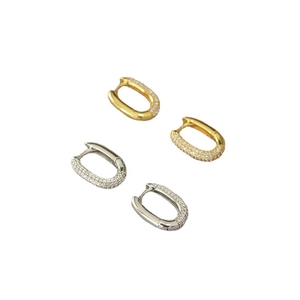 Modern U-shaped hoop earrings with micro-pave zircon crystals in gold and silver finishes