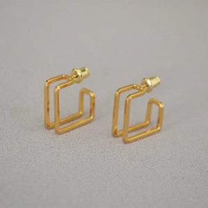 Minimalist gold square geometric stud earrings with a modern dual-frame metal design