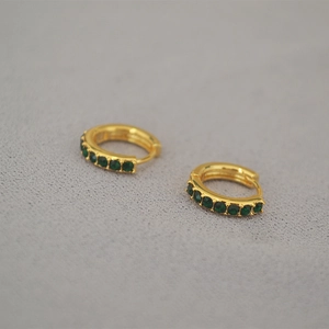 Minimalist gold hoop earrings with small green gemstones for daily commuters