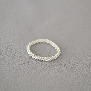 Minimalist textured silver chain ring with a sparkling granulated surface finish