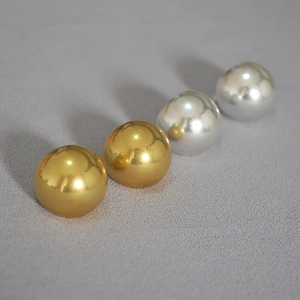Polished gold and silver hollow sphere stud earrings in minimalist retro style for women