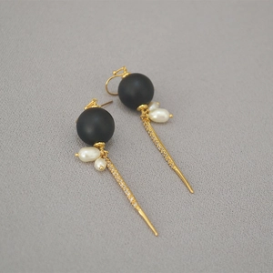 Elegant long baroque drop earrings with black beads and sparkling tassel accents