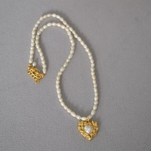 Vintage irregular gold heart necklace with freshwater pearls and lava texture pendant