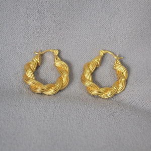 Modern twisted rope hoop earrings with metallic gold texture and woven design for women