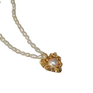 Vintage irregular heart pearl necklace with white rice pearls and gold lava frame charm