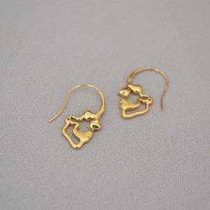 Minimalist gold-plated brass skull earrings with abstract organic heart-shaped design