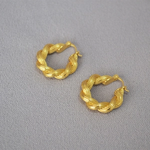 Modern twisted rope gold hoop earrings with textured metal weave design for women