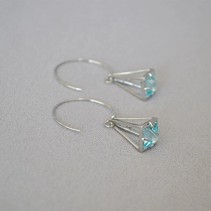 Minimalist silver birdcage earrings with square light blue zircon in geometric frame