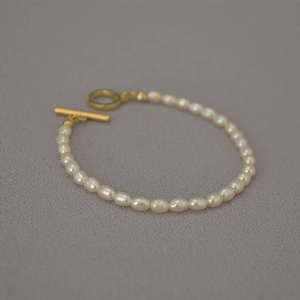 Elegant French irregular freshwater rice pearl bracelet with golden OT toggle clasp