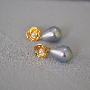 Detail of vintage gold flower earrings with colorful halo teardrop pearls and S925 needles