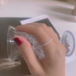 Elegant elastic freshwater pearl ring for women in minimalist Korean style worn on finger