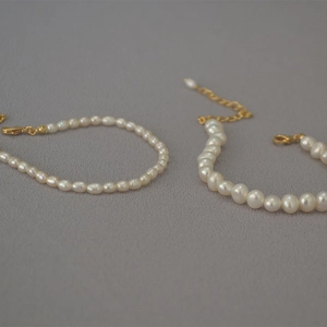 Elegant freshwater pearl bracelets featuring rice and round pearls with gold OT toggle clasp