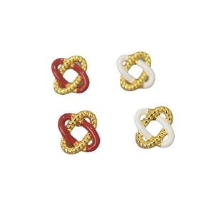 Elegant red and white enamel knot earrings with gold twist texture for a retro aesthetic