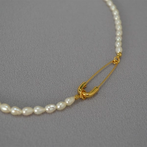 Elegant freshwater pearl necklace with creative gold safety pin clasp design for women