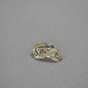 Detailed view of irregular hammered texture on a silver chain-style statement ring
