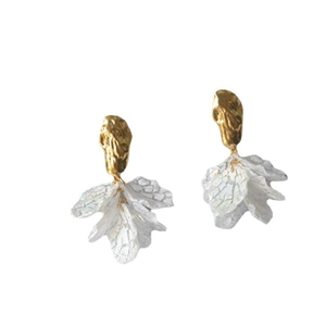 Elegant gold metal fish tail earrings with white textured petals and silver pins