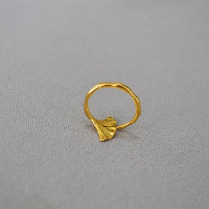 Adjustable gold-plated brass ginkgo leaf ring featuring detailed leaf texture and wave band