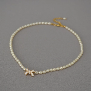 Handmade white enamel butterfly and freshwater pearl necklace with gold-plated lobster clasp