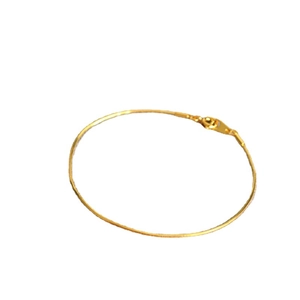 Minimalist multi-faceted thin gold snake chain bracelet on a clean white background