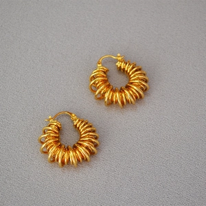 Vintage gold-plated brass hoop earrings with hollow spiral telephone wire texture design