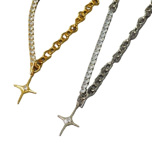 Gold and silver layered tennis chain necklaces with sparkling North Star pendants