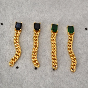 Elegant emerald green and black stone long chain tassel earrings in gold-plated brass finish