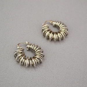 Retro coiled telephone wire spring hoop earrings in silver plated brass finish