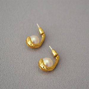 Retro matte gold hook earrings with lava texture and central pearl inlay for women