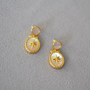 French vintage gold oval earrings with white mother of pearl and North Star design
