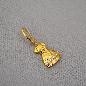 Retro gold dress earrings featuring shimmering zircons on a textured fabric background