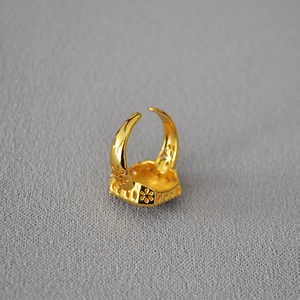Vintage golden adjustable open ring featuring hollowed floral patterns and retro design