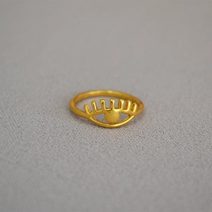 Minimalist gold plated brass ring with eye-shaped hollow design and eyelash detailing