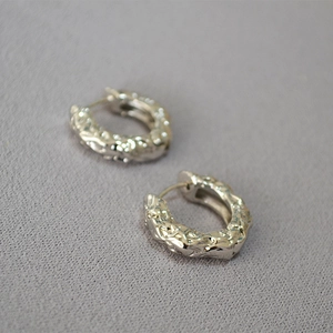 Minimalist silver lava texture hoop earrings with irregular molten surface design