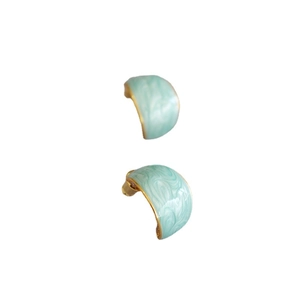 Mint green enamel C-shaped earrings with gold trim and white marble pattern design