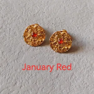 Artistic hammered gold stud earrings with round red garnet stone for January birthday