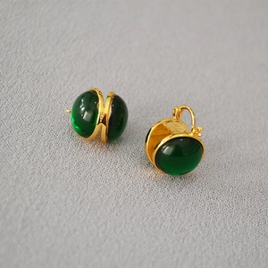 Vintage gold plated earrings with round green glass cabochons in a minimalist French style