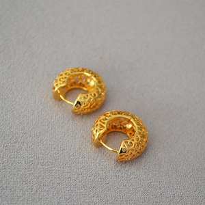 Vintage hollow gold hoop earrings with intricate palace floral patterns in matte finish