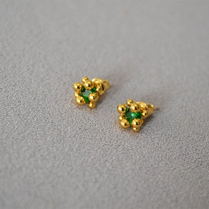 Golden flower bud stud earrings with green zircon centers and sterling silver needles