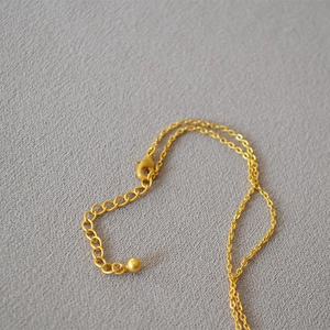 French vintage gold necklace with quilted heart pendant and lobster clasp detail