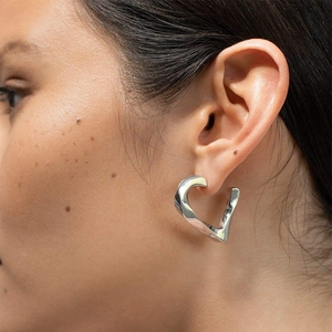 Artistic silver twisted heart earrings for women with a unique fluid metal design