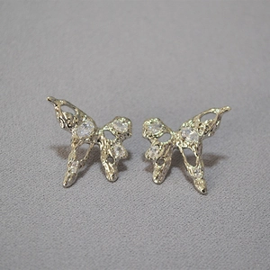 Silver butterfly stud earrings with liquid metal texture and sparkling cubic zirconia crystals