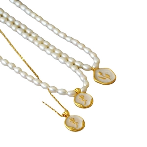 French retro gold pendant necklace with freshwater pearls and white enamel rose charms