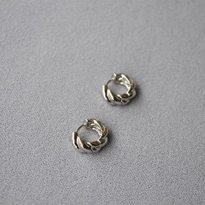 Silver twisted croissant hoop earrings in polished finish for women with minimalist style