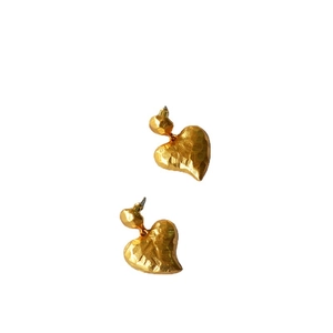 Irregular hammered gold heart earrings with vintage textured surface and stud style