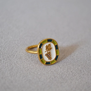 Artistic gold-plated vine ring with colorful enamel inlay in a French garden style