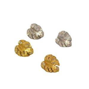 Tropical palm leaf stud earrings in gold and silver finish with inlaid zircons