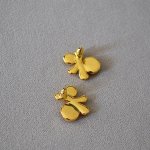 Retro irregular gold butterfly earrings with textured organic shape and mirror finish